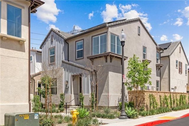 view of front of house featuring stucco siding