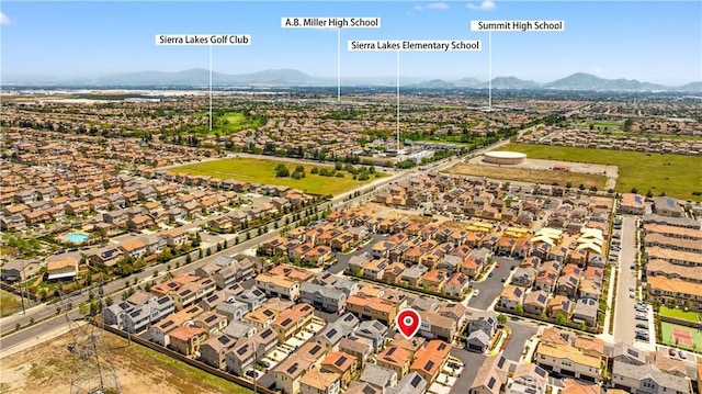 drone / aerial view featuring a mountain view and a residential view