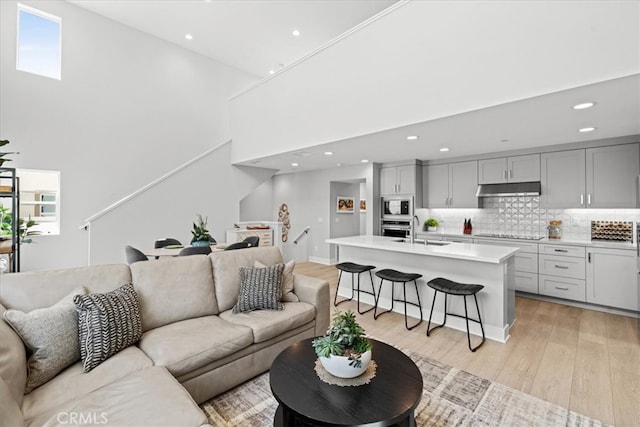 2902 Foundry Ct, Redondo Beach, CA 90278 - living room with a towering ceiling, recessed lighting, and light wood-style floors
