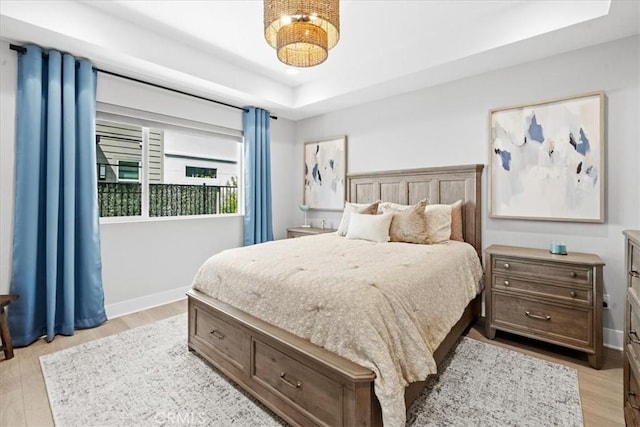2902 Foundry Ct, Redondo Beach, CA 90278 - bedroom featuring light wood-type flooring, baseboards, and a tray ceiling