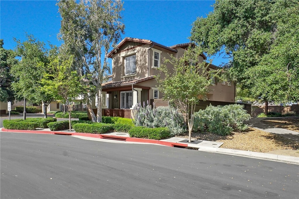 1925 Canopy Ln, La Verne, CA 91750 - view of front of home with stucco siding and a tile roof