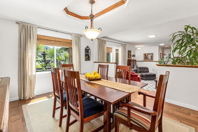 dining room featuring recessed lighting, light wood finished floors, and baseboards