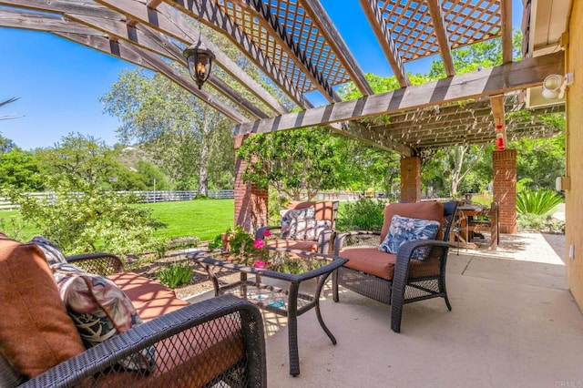 view of patio featuring a pergola, fence, and an outdoor living space