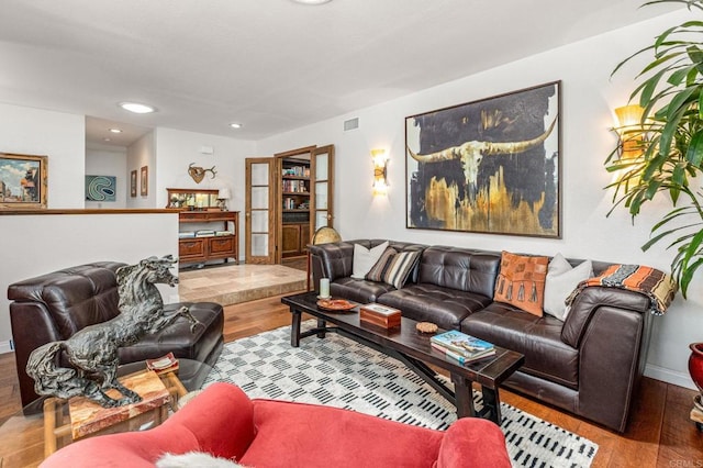 living room with recessed lighting, wood finished floors, and baseboards