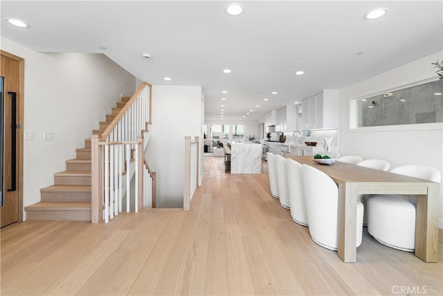 105A Surfside Ave, Surfside, CA 90743 - dining space featuring light wood finished floors, recessed lighting, and stairway