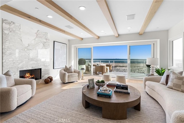 105A Surfside Ave, Surfside, CA 90743 - living area featuring a fireplace, wood finished floors, beam ceiling, and recessed lighting