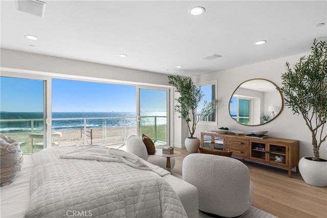 105A Surfside Ave, Surfside, CA 90743 - bedroom featuring a water view, recessed lighting, wood finished floors, and access to outside