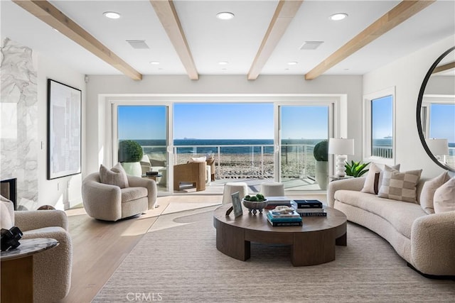 105A Surfside Ave, Surfside, CA 90743 - living room featuring beam ceiling, wood finished floors, recessed lighting, and a water view