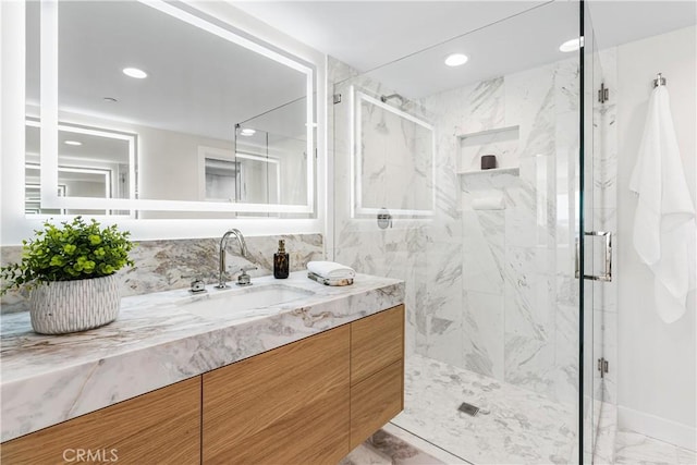 105A Surfside Ave, Surfside, CA 90743 - bathroom featuring a marble finish shower, vanity, marble look tile flooring, and recessed lighting