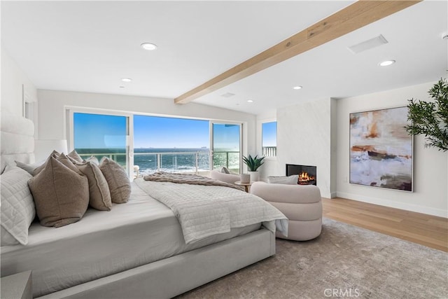 105A Surfside Ave, Surfside, CA 90743 - bedroom featuring wood finished floors, a large fireplace, recessed lighting, and a water view