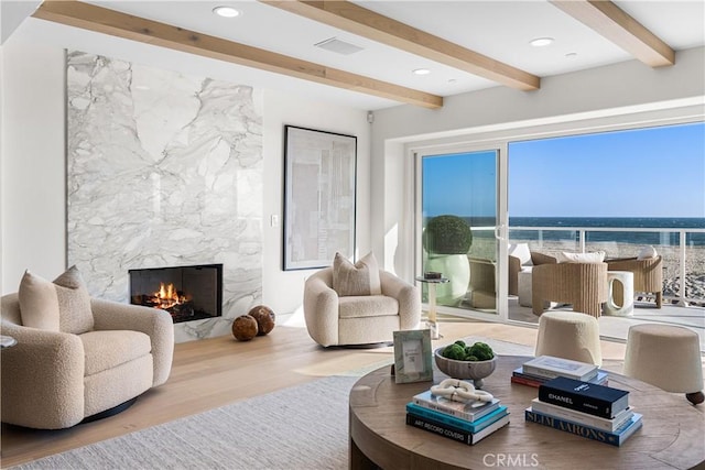 105A Surfside Ave, Surfside, CA 90743 - living room with wood finished floors, beam ceiling, a fireplace, and recessed lighting