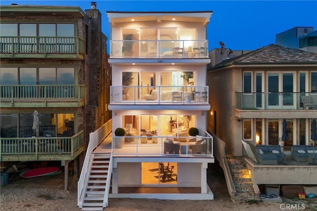 105A Surfside Ave, Surfside, CA 90743 - rear view of house with stairway and stucco siding