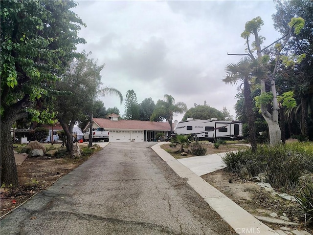 14055 Camino Del Oro, Riverside, CA 92508 - view of front of property with asphalt driveway and an attached garage