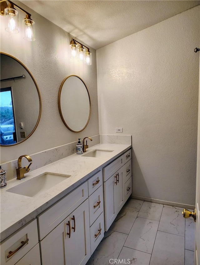 14055 Camino Del Oro, Riverside, CA 92508 - full bath featuring marble look tile flooring, double vanity, a textured ceiling, and a textured wall