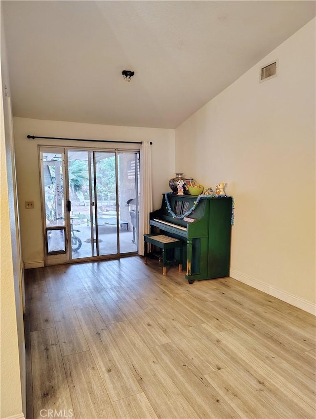 14055 Camino Del Oro, Riverside, CA 92508 - living area with vaulted ceiling, wood finished floors, and baseboards