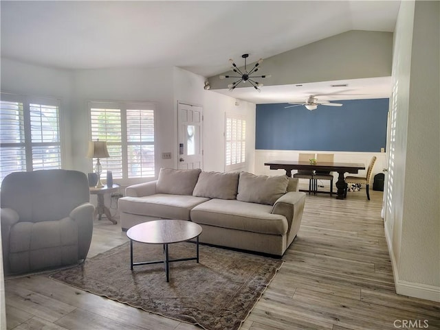 14055 Camino Del Oro, Riverside, CA 92508 - living room featuring lofted ceiling, wood finished floors, ceiling fan, and a chandelier