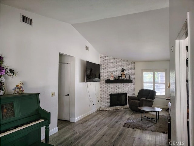 14055 Camino Del Oro, Riverside, CA 92508 - sitting room with wood finished floors, a brick fireplace, baseboards, and lofted ceiling