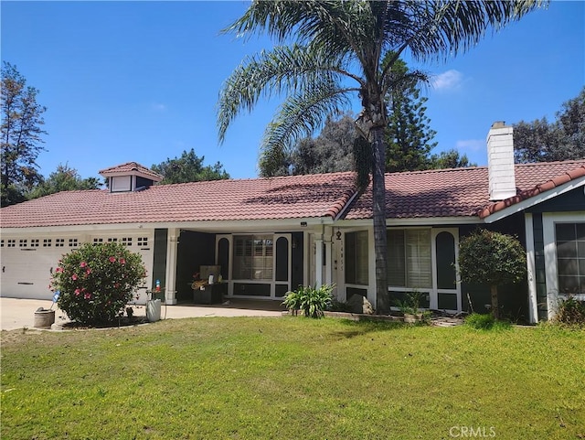 14055 Camino Del Oro, Riverside, CA 92508 - rear view of property featuring a tile roof, a garage, a yard, a chimney, and driveway