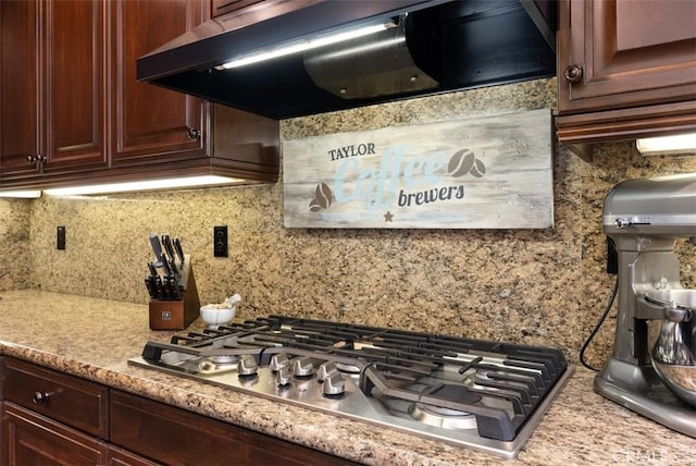9 Healdsbury, Irvine, CA 92602 - interior details with stainless steel gas cooktop, dark brown cabinets, decorative backsplash, and range hood