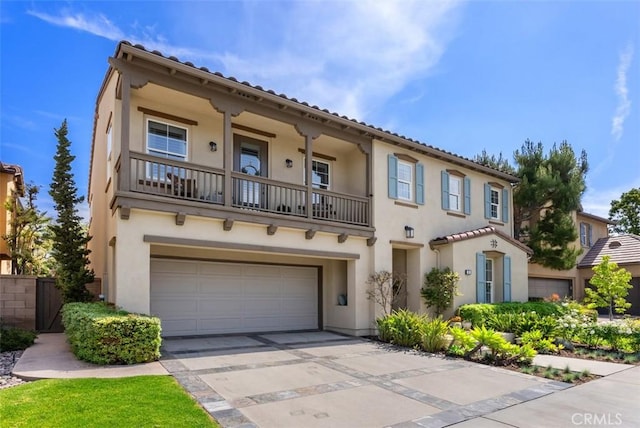 9 Healdsbury, Irvine, CA 92602 - mediterranean / spanish house with fence, a garage, stucco siding, a balcony, and driveway