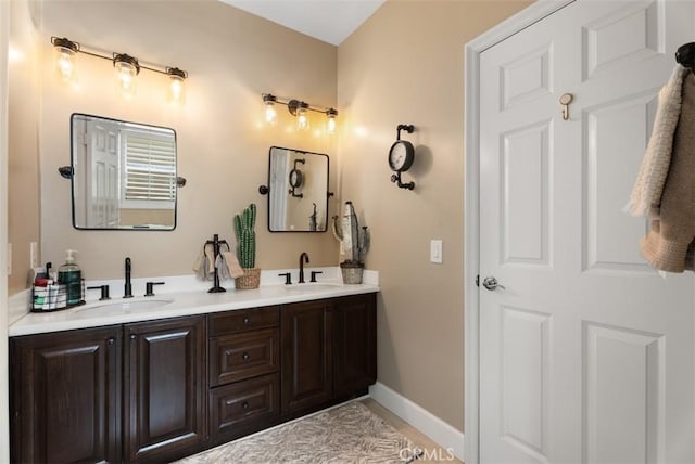 9 Healdsbury, Irvine, CA 92602 - bathroom featuring double vanity, a sink, and baseboards