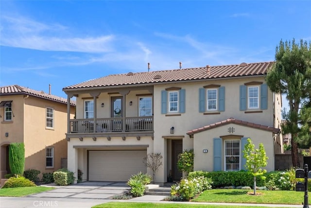 9 Healdsbury, Irvine, CA 92602 - mediterranean / spanish home with a tiled roof, driveway, a balcony, an attached garage, and stucco siding