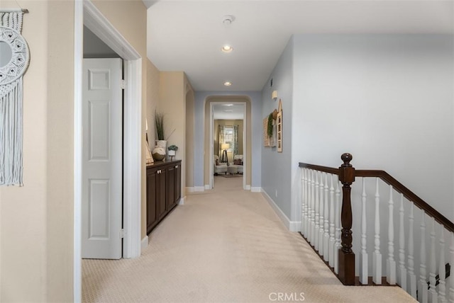 9 Healdsbury, Irvine, CA 92602 - corridor with baseboards, light colored carpet, recessed lighting, arched walkways, and an upstairs landing