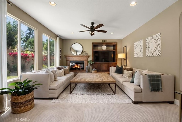 9 Healdsbury, Irvine, CA 92602 - living area featuring recessed lighting, ceiling fan, a glass covered fireplace, and light colored carpet