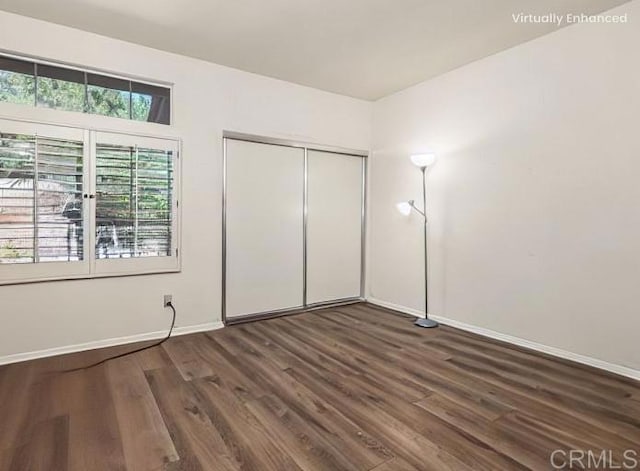 3602 Hidden Ridge Rd, Jamul, CA 91935 - unfurnished bedroom with baseboards, dark wood-style flooring, and a closet