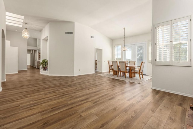3602 Hidden Ridge Rd, Jamul, CA 91935 - dining room with a chandelier, wood finished floors, lofted ceiling, and baseboards