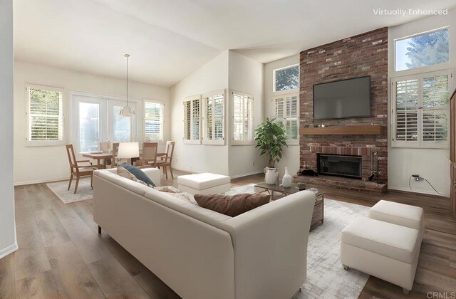 3602 Hidden Ridge Rd, Jamul, CA 91935 - living area featuring wood finished floors, vaulted ceiling, and a brick fireplace