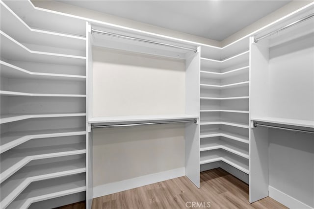 28166 Camellia Ct, Laguna Niguel, CA 92677 - walk in closet with wood finished floors