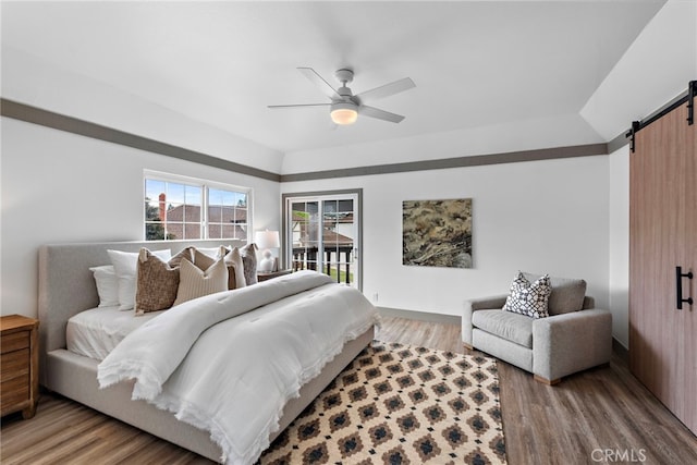 28166 Camellia Ct, Laguna Niguel, CA 92677 - bedroom featuring a barn door, light wood finished floors, a ceiling fan, and access to exterior