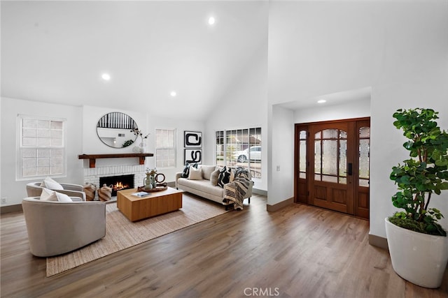 28166 Camellia Ct, Laguna Niguel, CA 92677 - living room with recessed lighting, a fireplace, high vaulted ceiling, baseboards, and wood finished floors