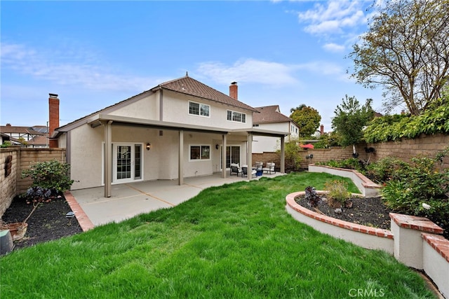 28166 Camellia Ct, Laguna Niguel, CA 92677 - back of house featuring stucco siding, a chimney, and a patio area