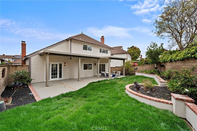 28166 Camellia Ct, Laguna Niguel, CA 92677 - rear view of house featuring stucco siding, a fenced backyard, a chimney, and a patio area