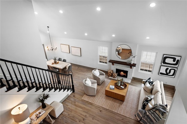28166 Camellia Ct, Laguna Niguel, CA 92677 - living area with wood finished floors, recessed lighting, a brick fireplace, a chandelier, and baseboards