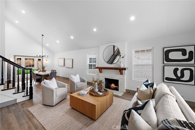28166 Camellia Ct, Laguna Niguel, CA 92677 - living area featuring a brick fireplace, recessed lighting, an inviting chandelier, and wood finished floors