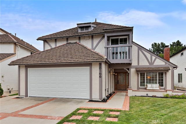 28166 Camellia Ct, Laguna Niguel, CA 92677 - tudor-style house featuring stucco siding, an attached garage, driveway, and a front lawn