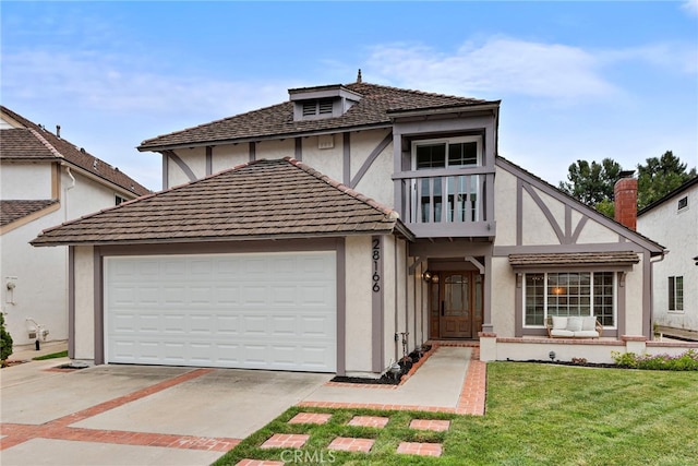 28166 Camellia Ct, Laguna Niguel, CA 92677 - tudor house with stucco siding, an attached garage, concrete driveway, and a front lawn