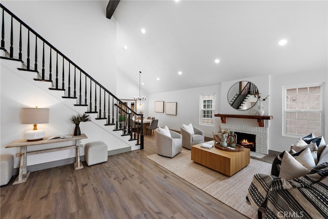 28166 Camellia Ct, Laguna Niguel, CA 92677 - living area with wood finished floors, a brick fireplace, stairs, high vaulted ceiling, and recessed lighting