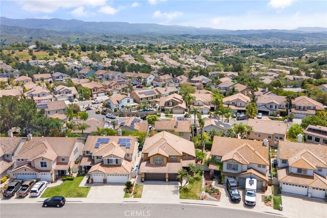 drone / aerial view with a mountain view and a residential view