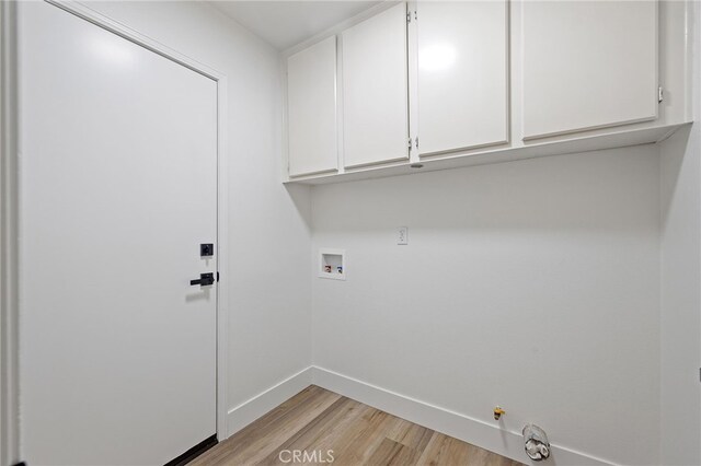 26 Apache Dr, Trabuco Canyon, CA 92679 - clothes washing area featuring light wood-style floors, cabinet space, baseboards, hookup for a washing machine, and hookup for a gas dryer