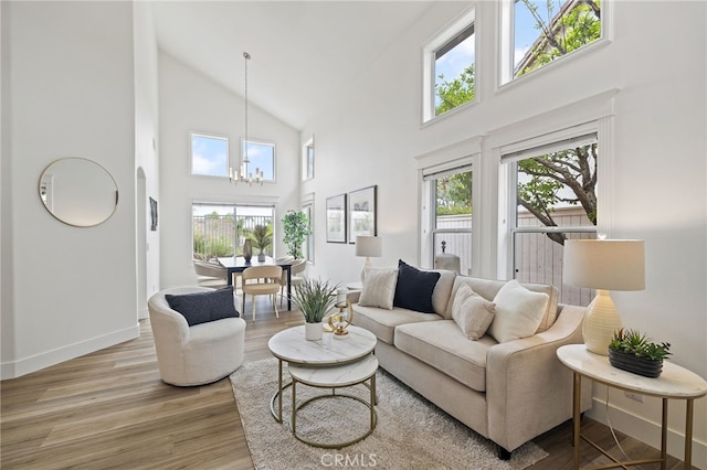 26 Apache Dr, Trabuco Canyon, CA 92679 - living area with high vaulted ceiling, a chandelier, wood finished floors, and baseboards
