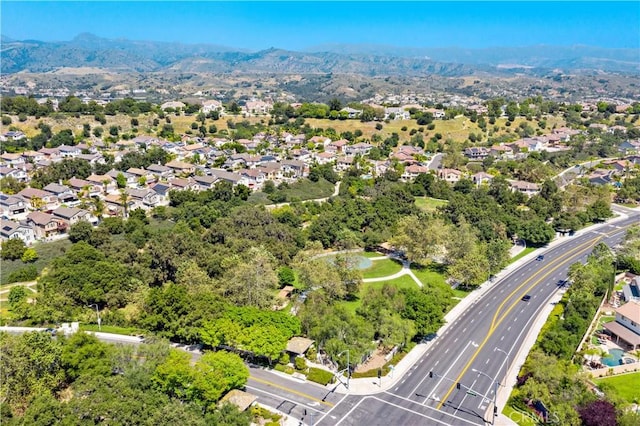drone / aerial view featuring a mountain view and a residential view