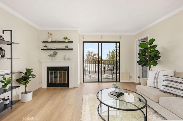 2599 Walnut Ave, Unit Signal Hill, CA 90755 - living area with wood finished floors, crown molding, a glass covered fireplace, and baseboards