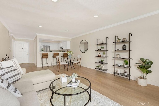 2599 Walnut Ave, Unit Signal Hill, CA 90755 - living room featuring light wood finished floors, recessed lighting, and ornamental molding