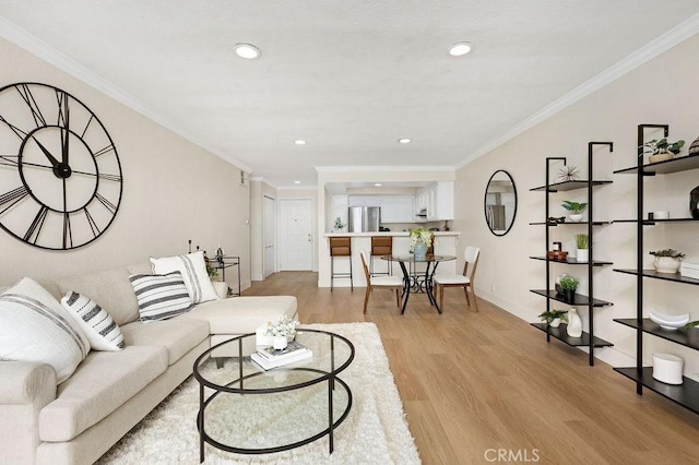 2599 Walnut Ave, Unit Signal Hill, CA 90755 - living area featuring light wood finished floors, ornamental molding, recessed lighting, and baseboards
