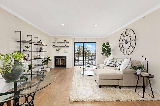 2599 Walnut Ave, Unit Signal Hill, CA 90755 - living area with wood finished floors, a glass covered fireplace, ornamental molding, recessed lighting, and baseboards