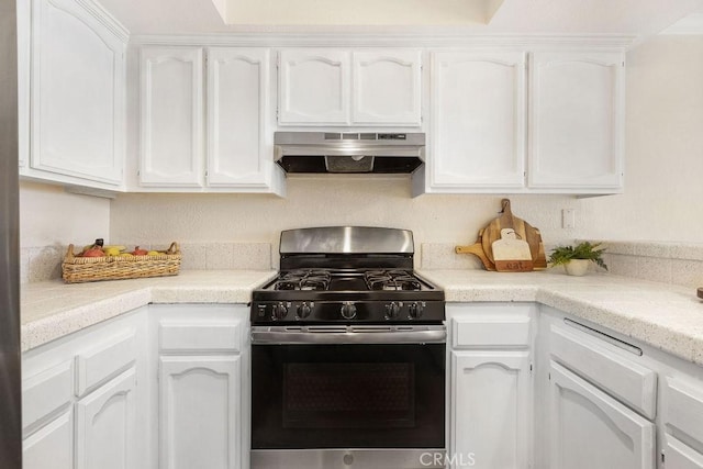 2599 Walnut Ave, Unit Signal Hill, CA 90755 - kitchen featuring under cabinet range hood, gas stove, white cabinets, and light countertops